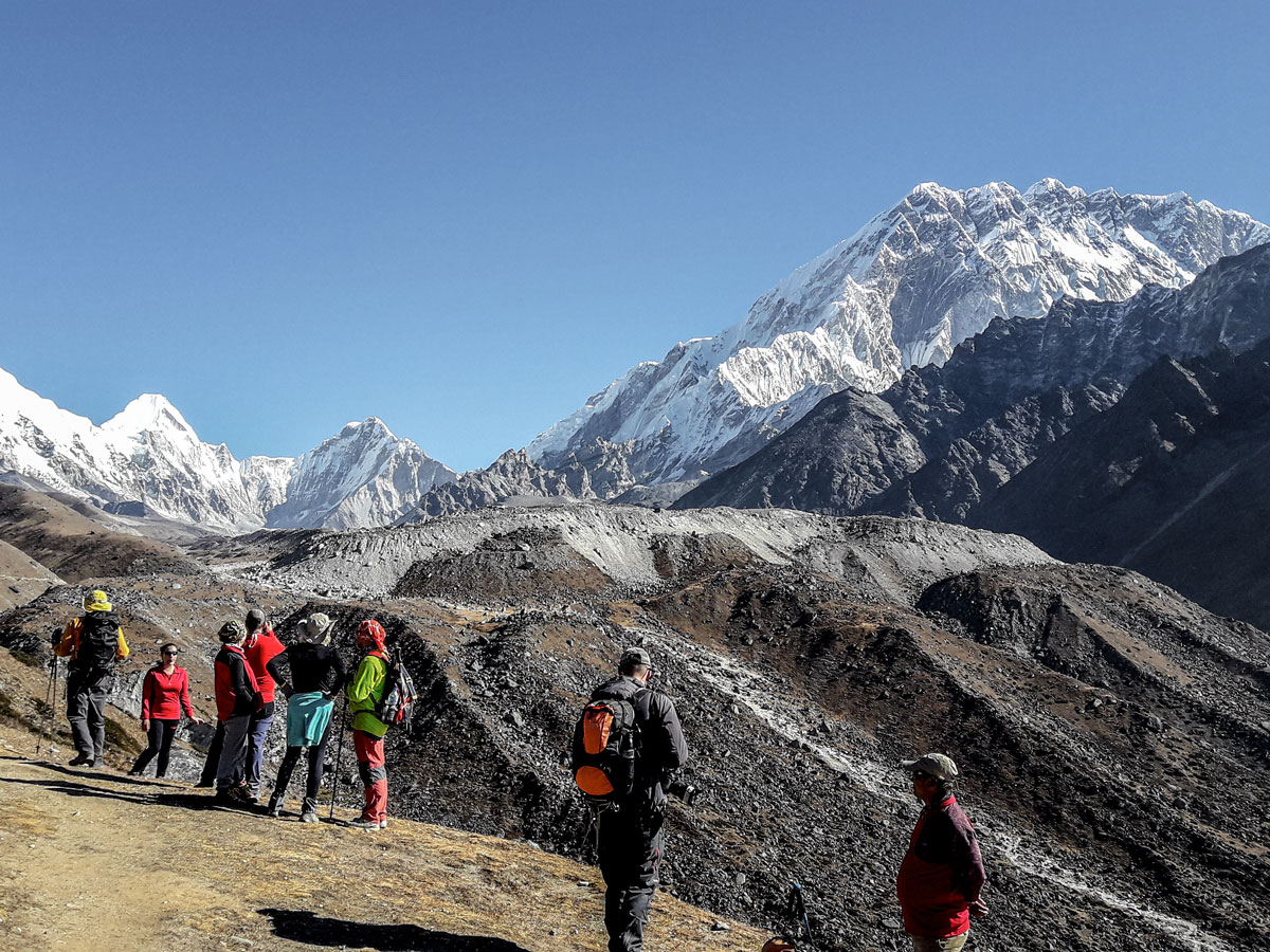 Group of hikers observing views on Everest Base Camp and Gokyo Lake trek in Nepal