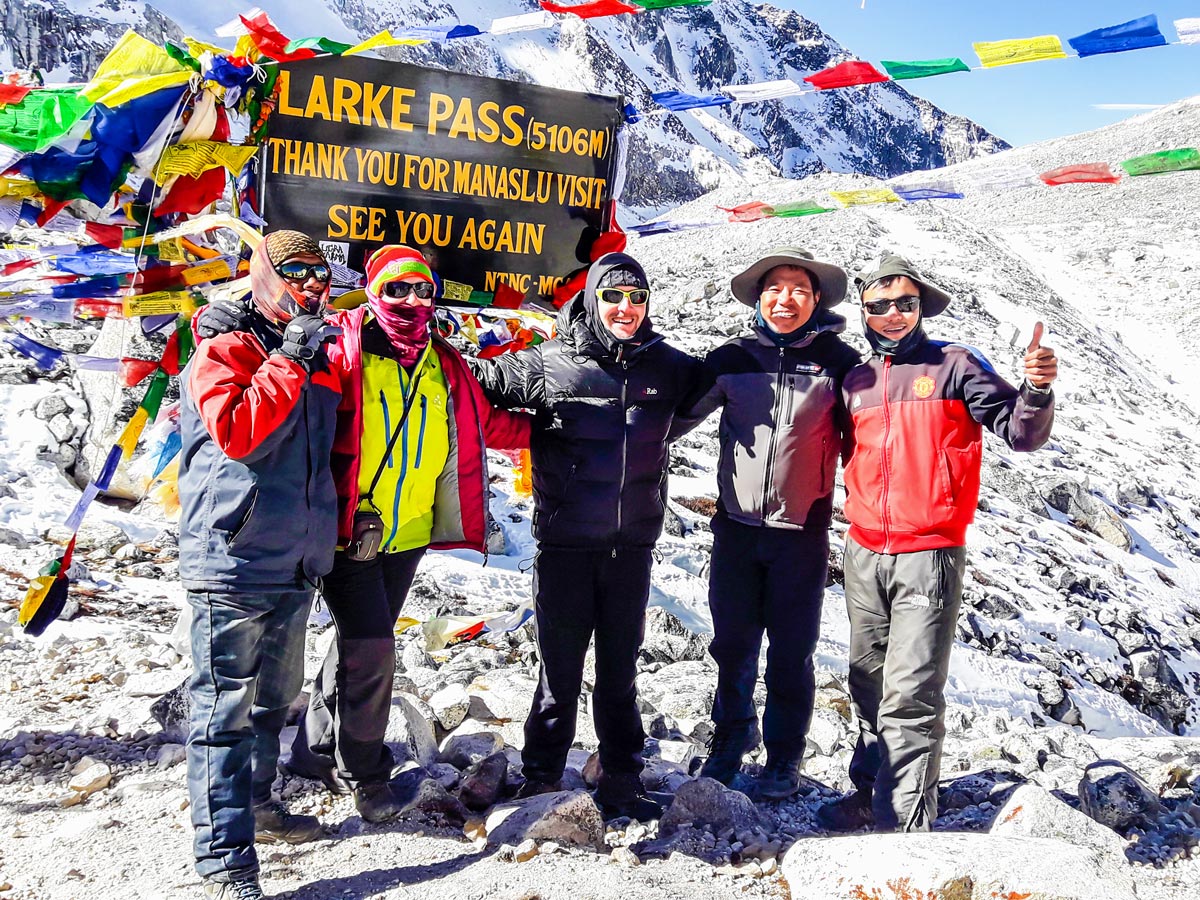 Hikers posing near Larke Pass on Manaslu Circuit trek in Nepal