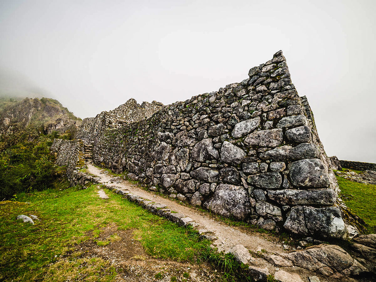 One of several Incan ruins youll see along Inca Trail to Machu Picchu near Cusco Peru