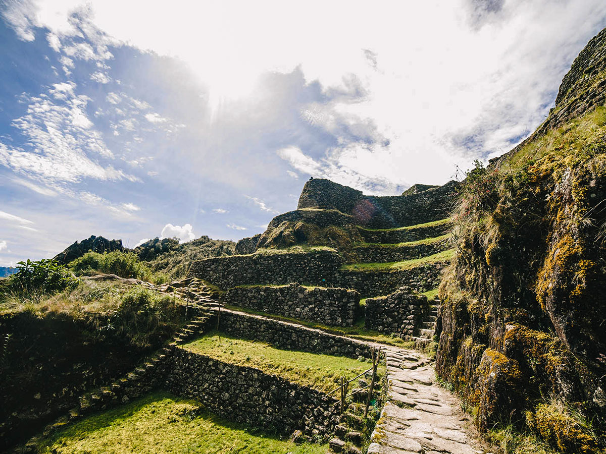 Exploring Incan ruins on Inca Trail to Machu Picchu near Cusco Peru