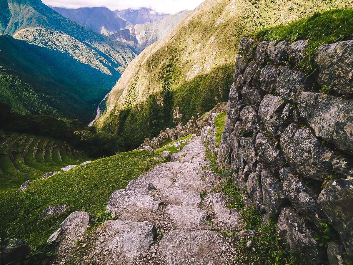 Exploring Winay Wayna ruins on Inca Trail to Machu Picchu near Cusco Peru