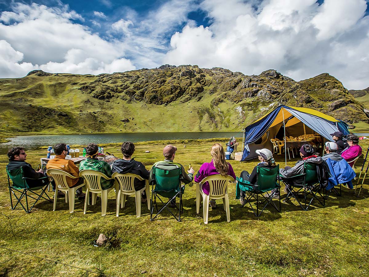 Resting with group on Lares Trek to Machu Picchu near Cusco Peru