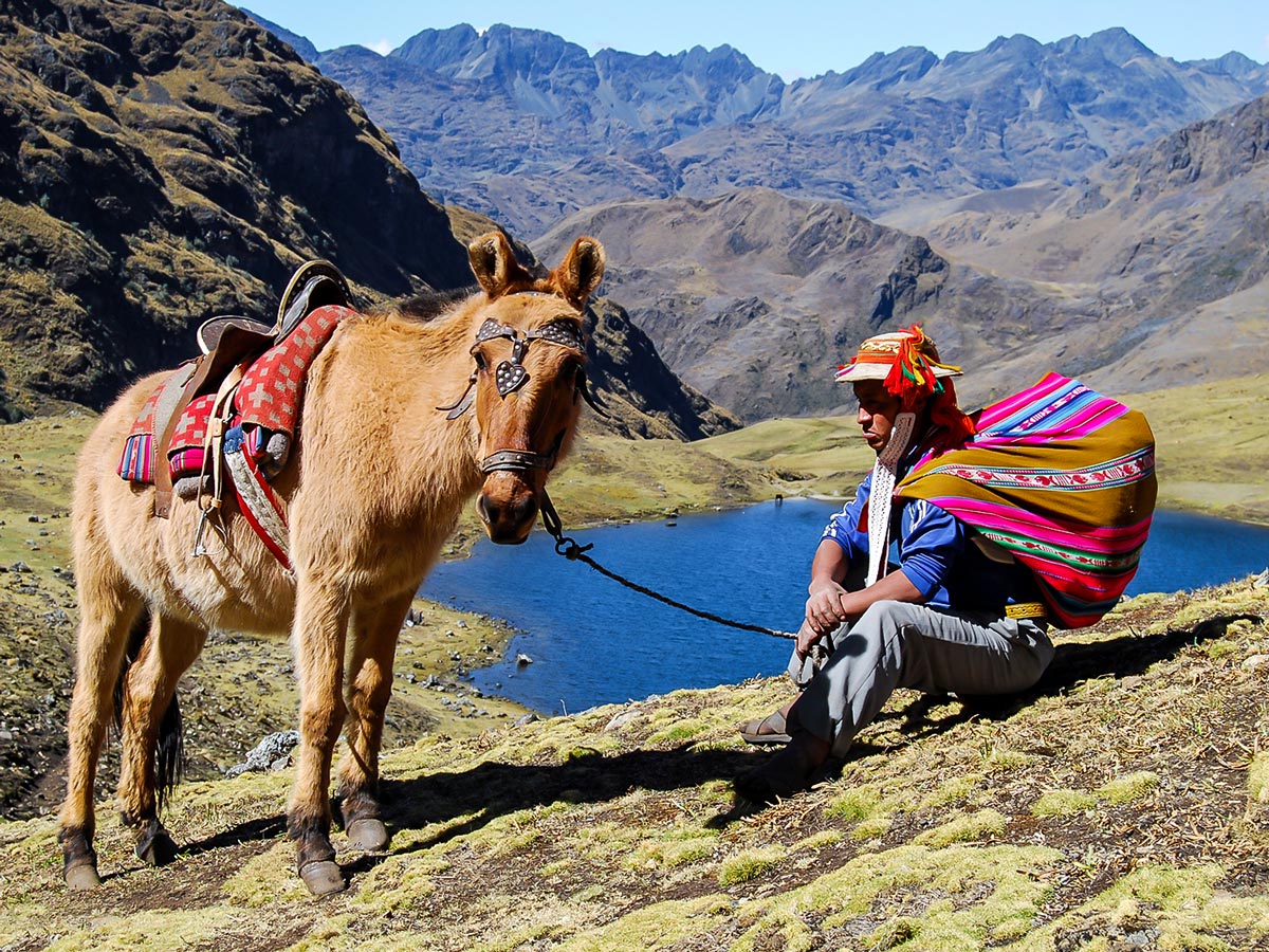 Horse local person and beautiful scenery behind on Lares Trek to Machu Picchu near Cusco Peru