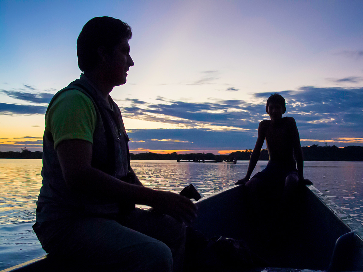 Crossing the Amazon River during the sunset on Amazon to Galapagos Tour