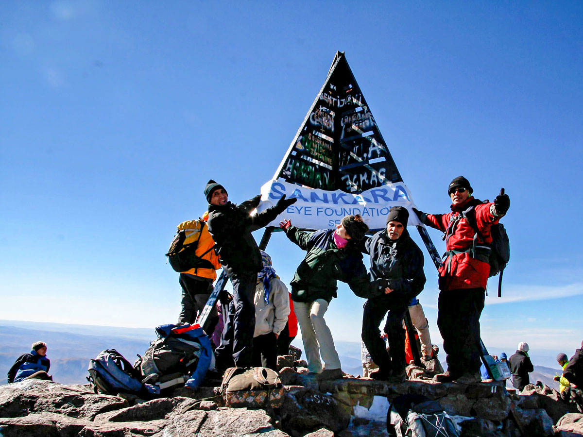 On the peak of Villages Valleys and Mt Toubkal Climb tour in Morocco