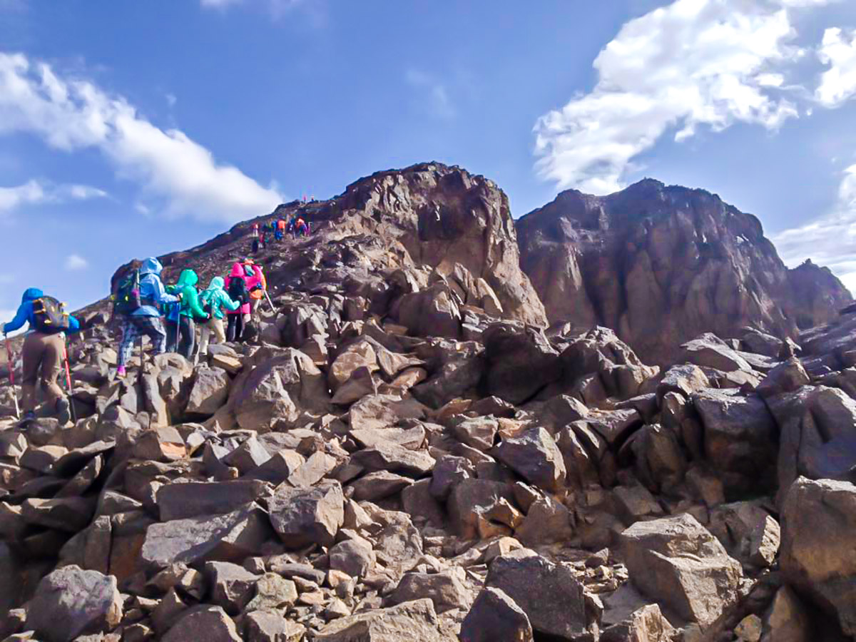 Climbing to the peak on Mt Toubkal Trek in Atlas Mountains Morocco