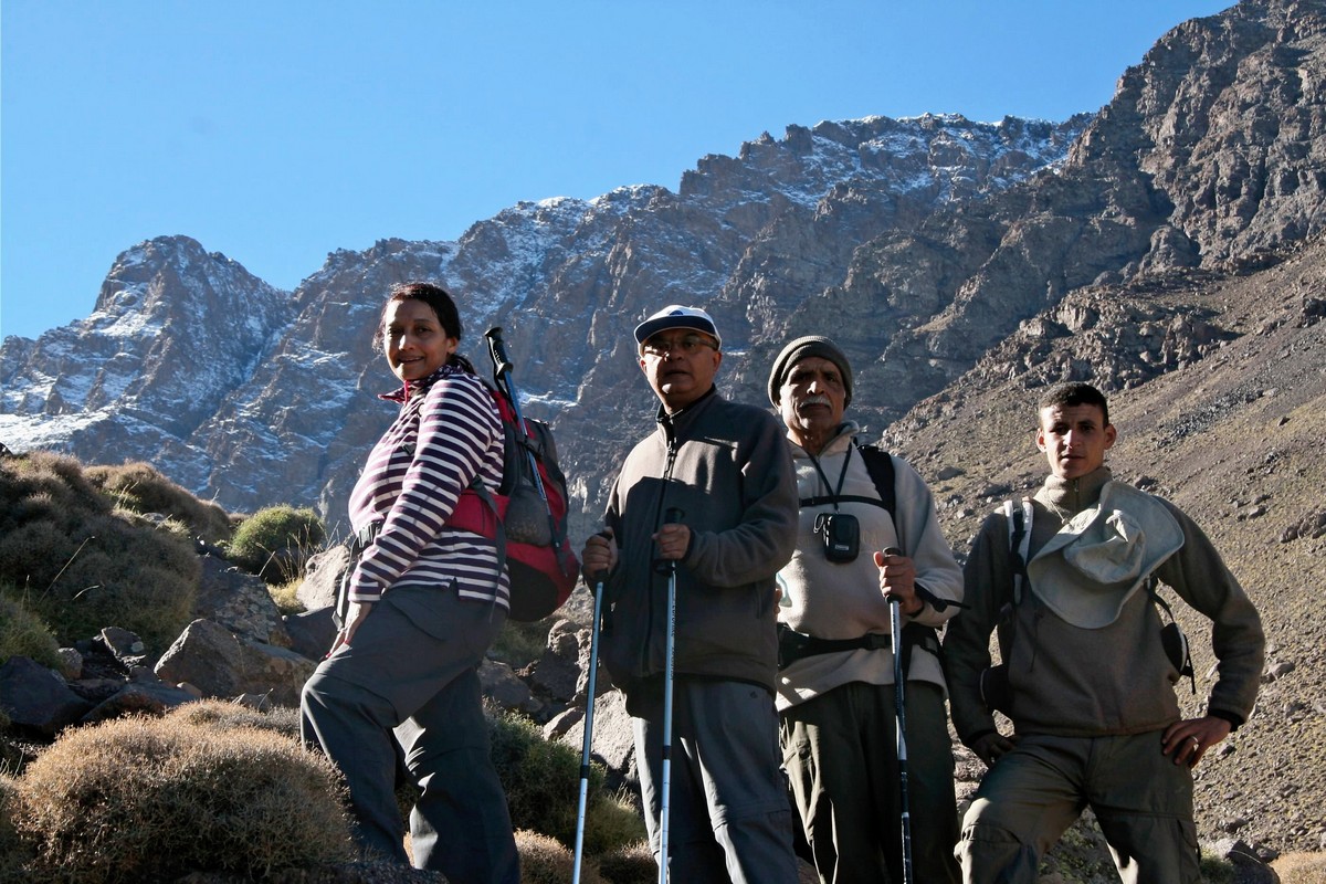 Posing in front of snowy peaks on guided tour to Atlas Mountains