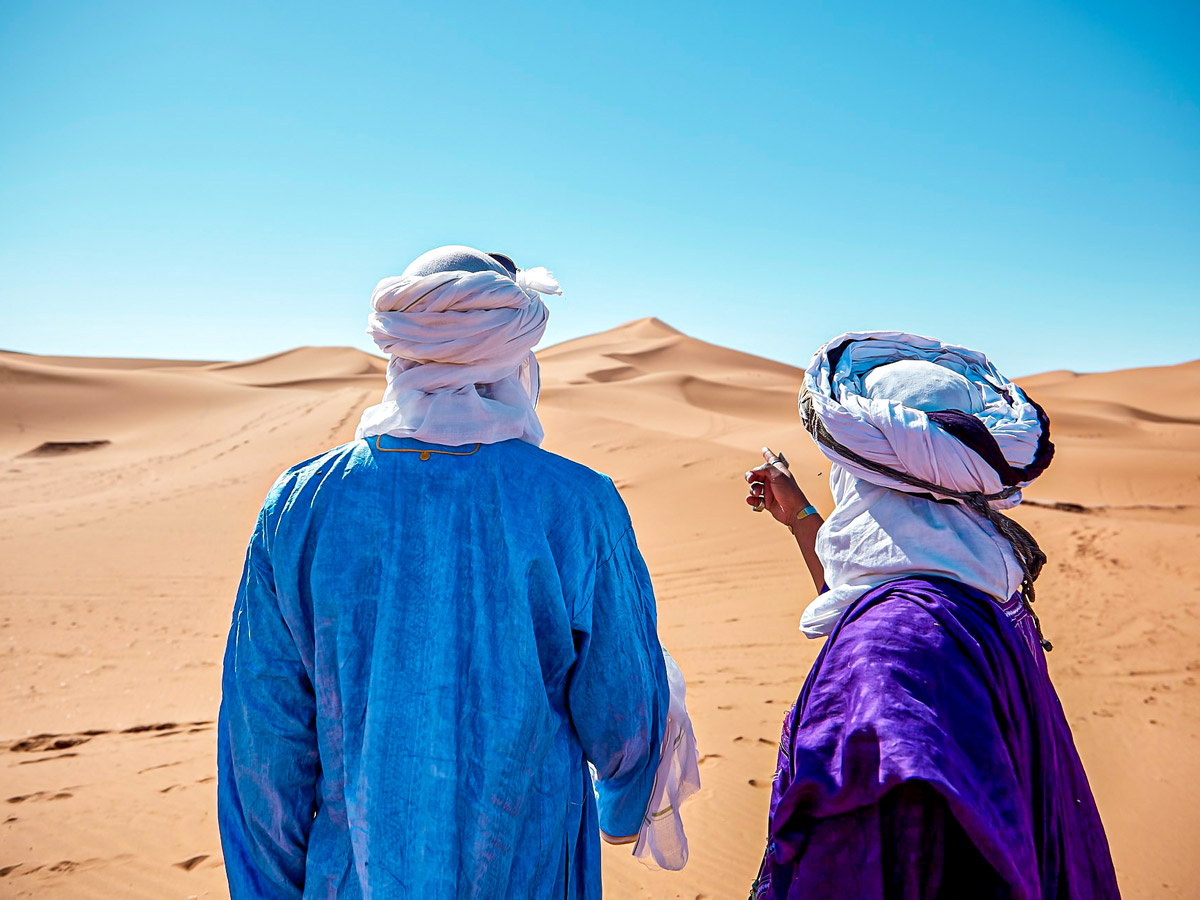 Guide and hiker on Merzouga Overland Tour in Morocco