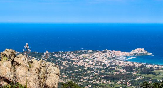 Looking down on Calvi village on Corte and Calvi trek in Corsica Island France