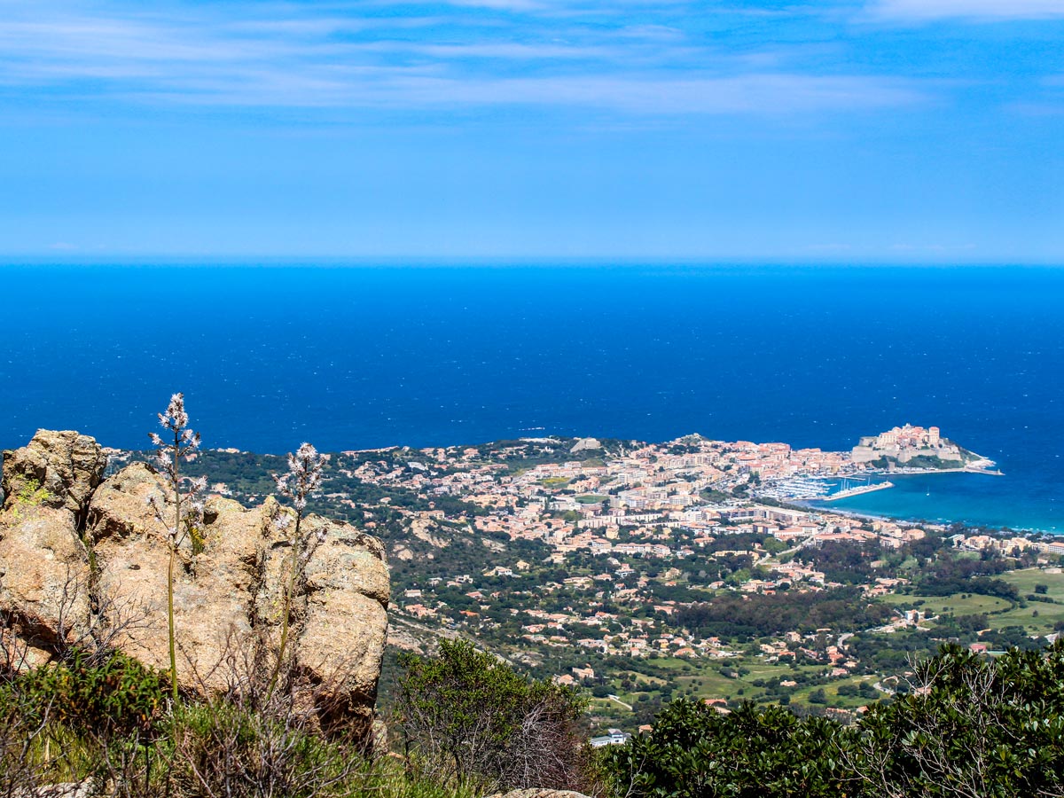 Looking down on Calvi village on Corte and Calvi trek in Corsica Island France