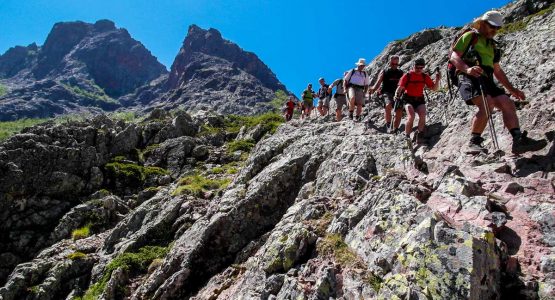 Hikers on the third day of trekking between Bonifatu and Haut Asco on GR20 trek in Corsica