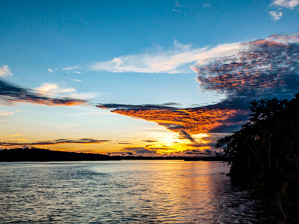 Stunning sunset above Amazon River seen on Anakonda Luxury Cruise Ship