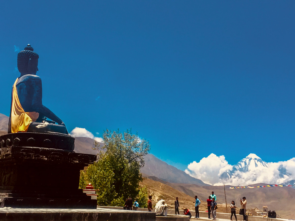 Big statue of Buddha on Annapurna Cycling tour in Nepal