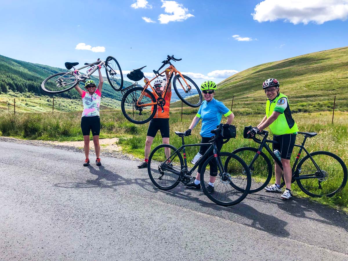 Group of bikers resting an posing on Arran Islay and Jura Road Biking Tour