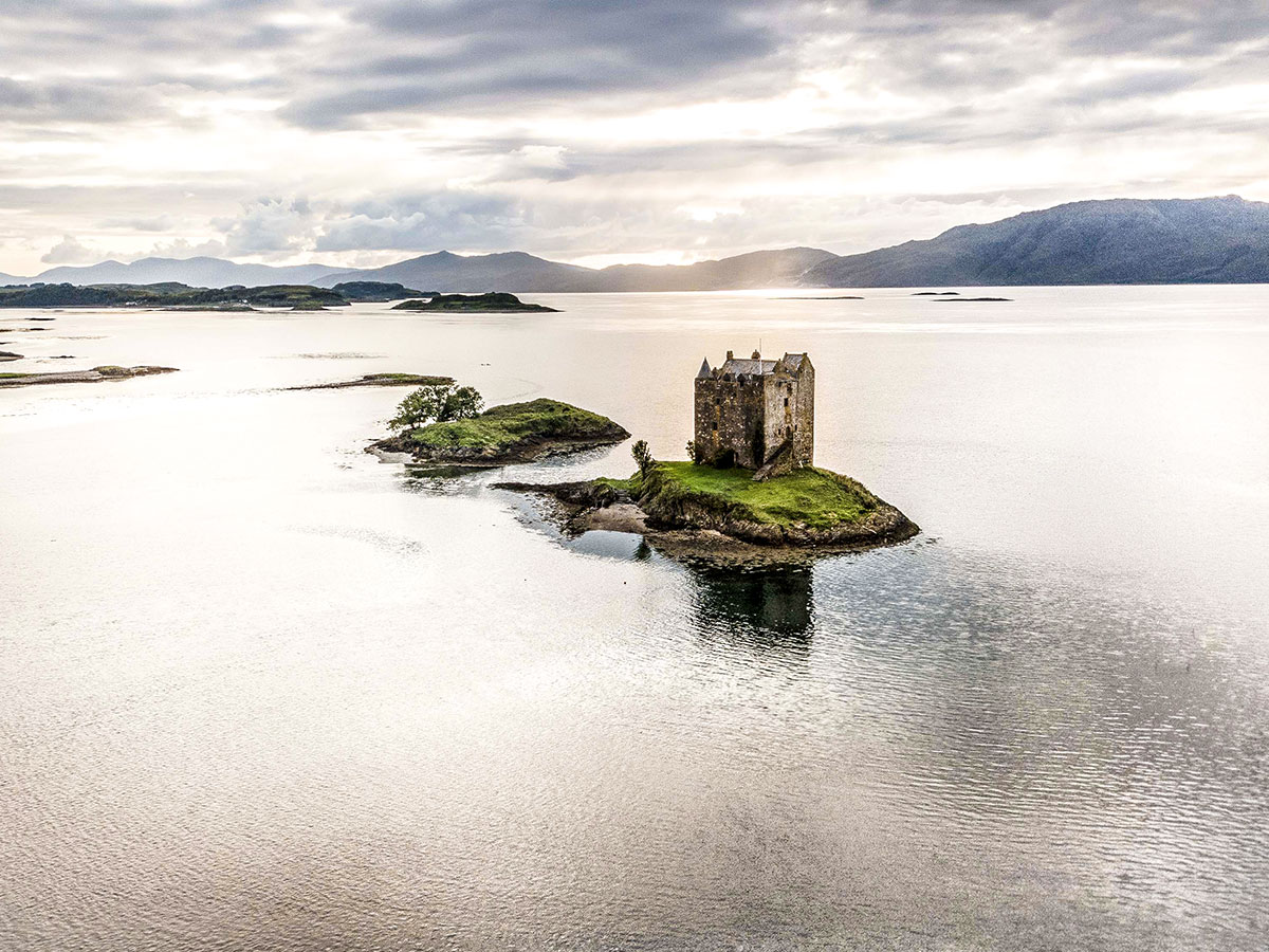 Aerial views of the castle on Loch Laich that can be seen on Glencoe and the Highlands trekking tour in Scotland