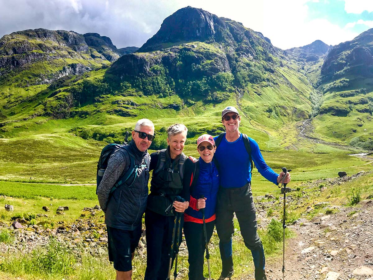 Posing in front of the mountains near Glencoe on Glencoe and the Highlands walking tour in Scotland