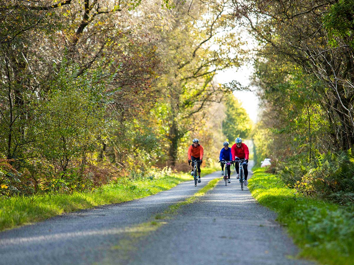 Two cyclists biking on the beauitful road on Road Cycling tour from Inverness to Edinburgh