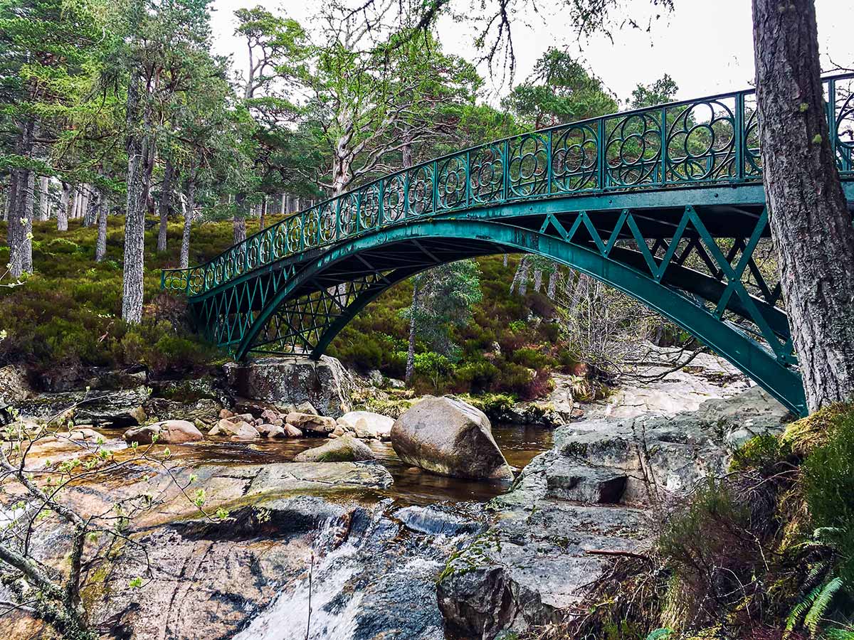 Green bridge over the river seen on National Parks of the UK Guided Walking Tour