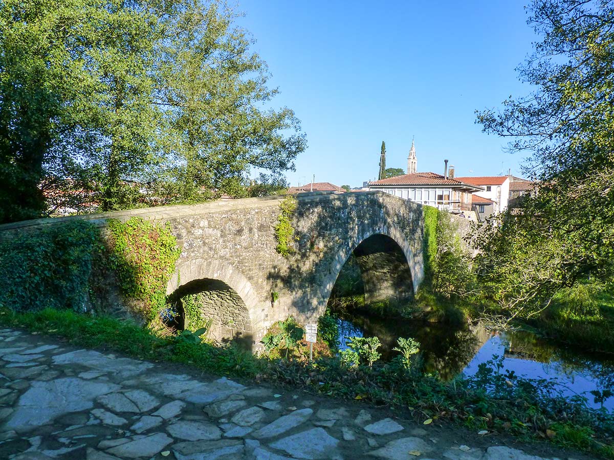 Crossing the Rio Furelos in Melide on French Camino Tour