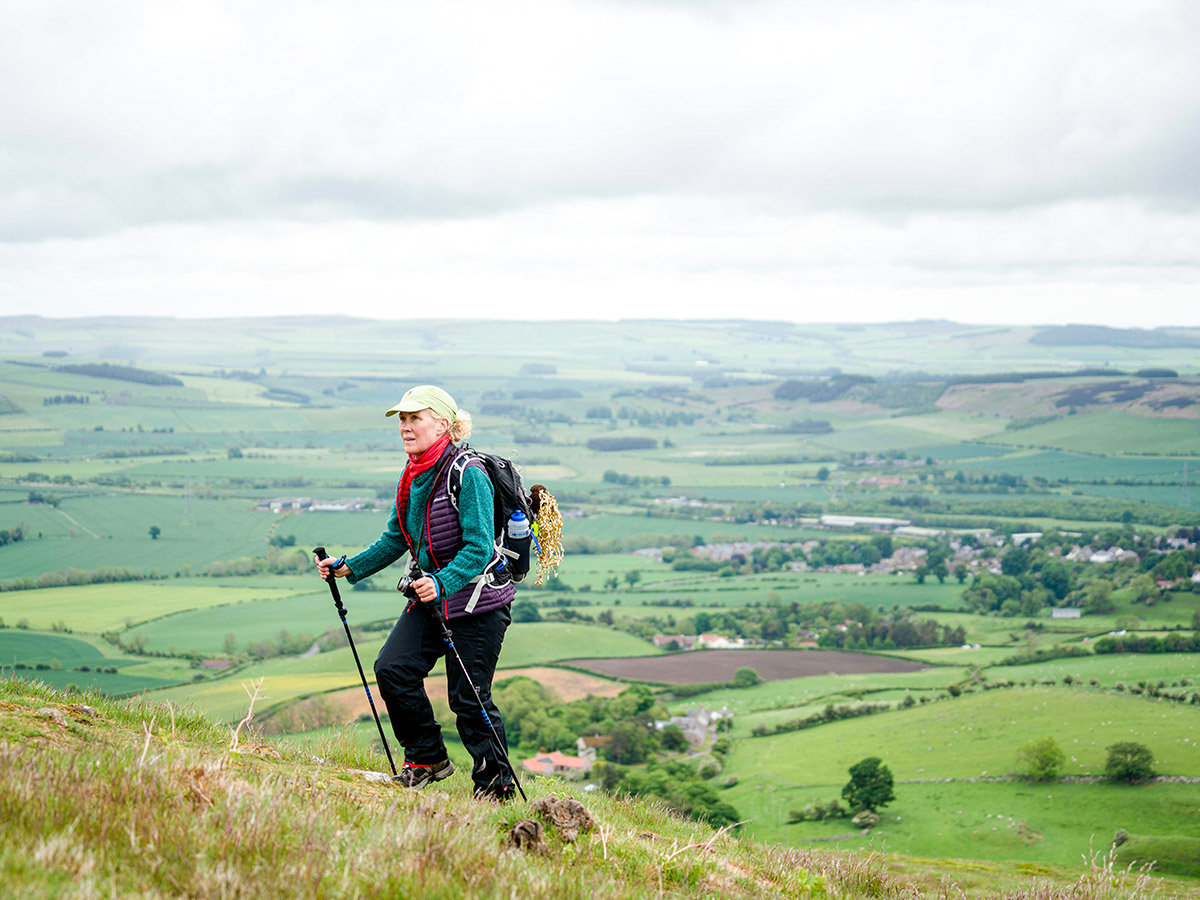 Hiker posing in front of the faltlands on Northumberland and the Lake District guided walking tour