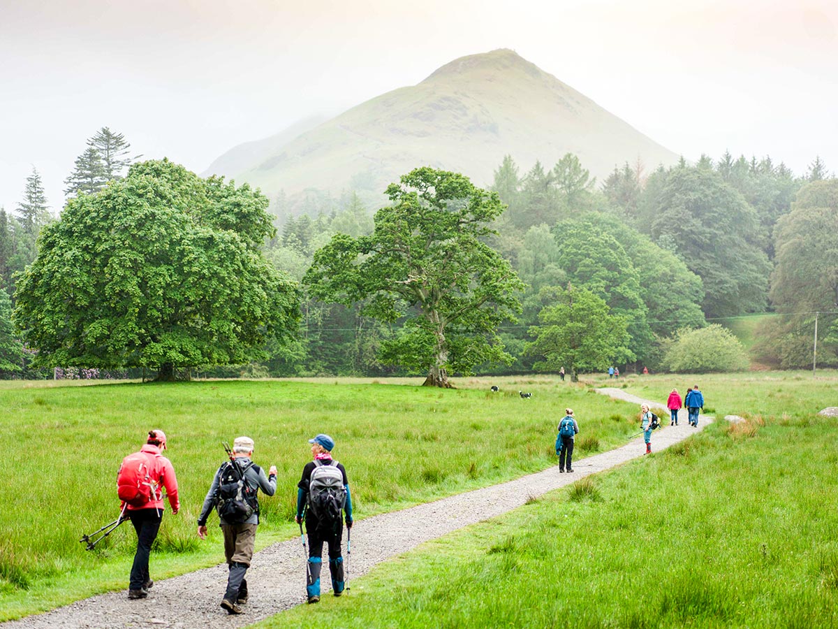 Group of hikers in front of the mountain on Northumberland and the Lake District guided walking tour