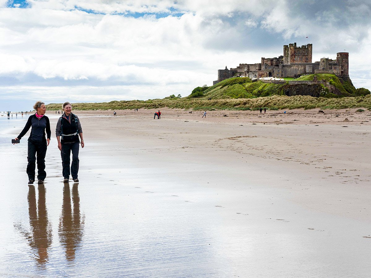 Walking along the Northumber Beach on Northumberland and the Lake District guided walking tour