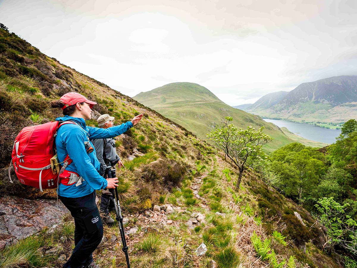 Hiker observing the views on Northumberland and the Lake District guided walking tour in England