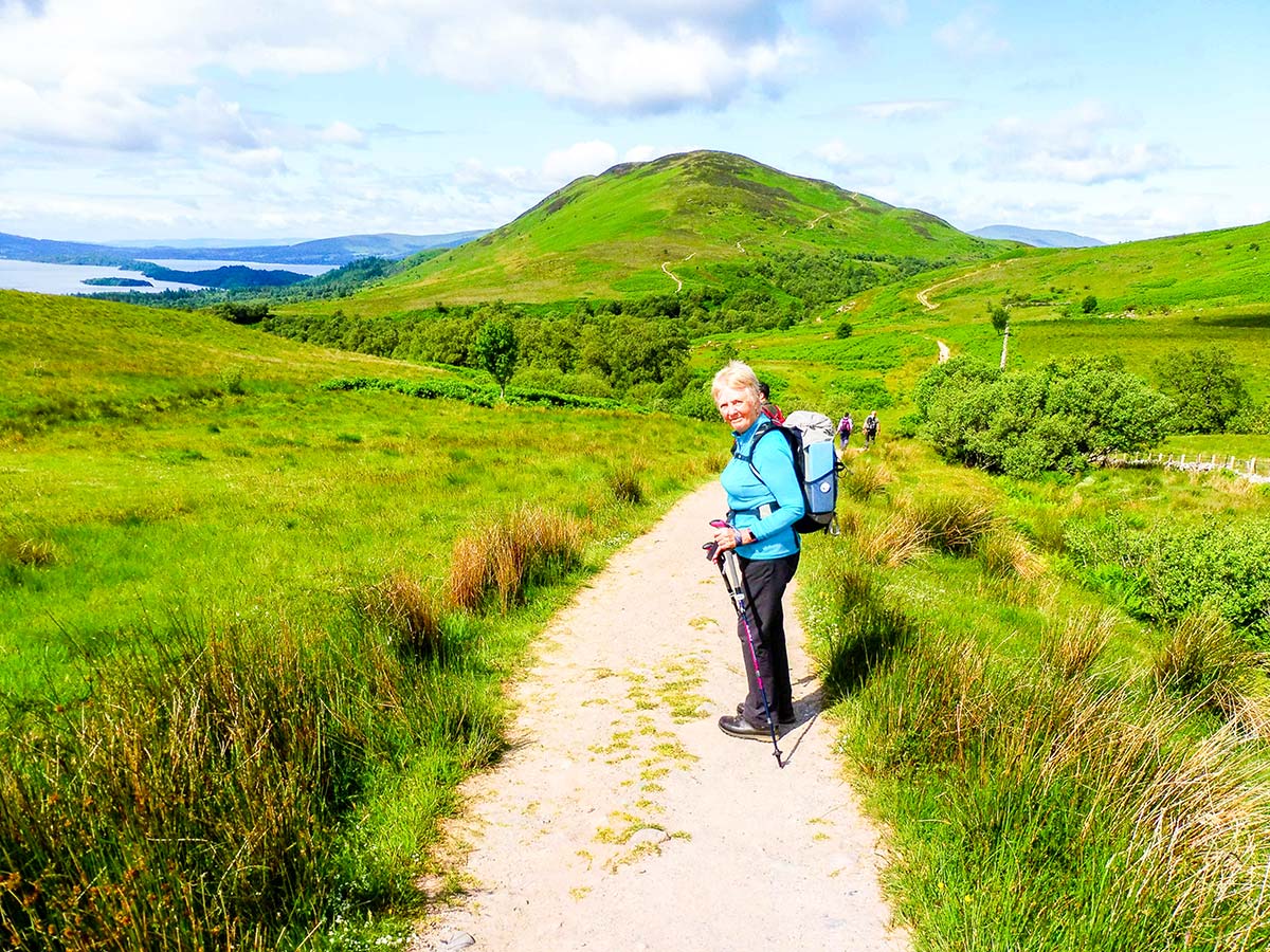 Walker posing on the trail of West Highland Way walking tour