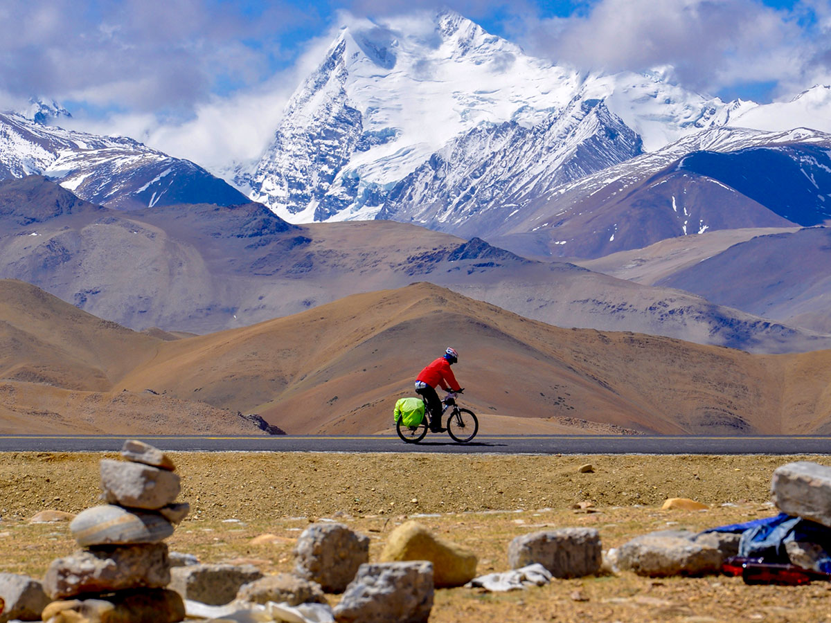 Biking among the Tibet mountains on Journey to Mount Kailash Tour in China
