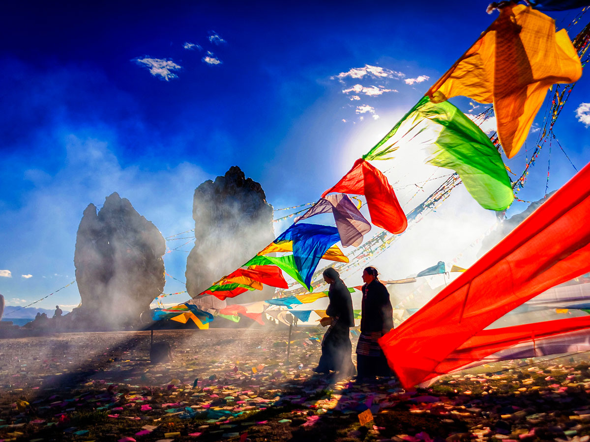 Prayer flags surrounded by stunning mountain views on Journey to Mount Kailash Tour in China