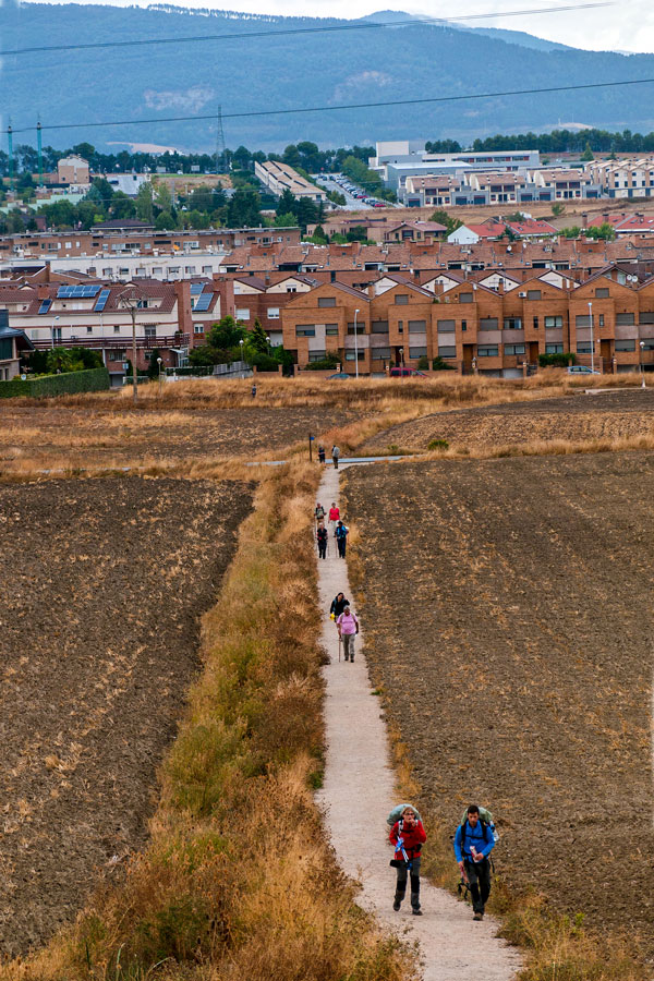 Goup of hikers departing Pamplona on Camino de Santiago French Way full trek