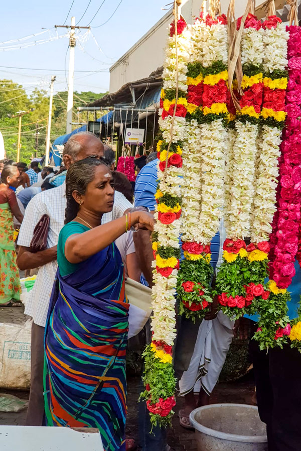 Biking in Western Ghats Tour in Kerala includes visiting the colorful market in Madurai