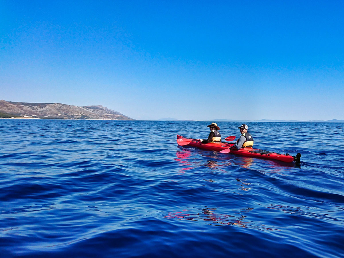 Family Adventure Tour in Croatia includes kayaking in the sea near Pakleni Islands