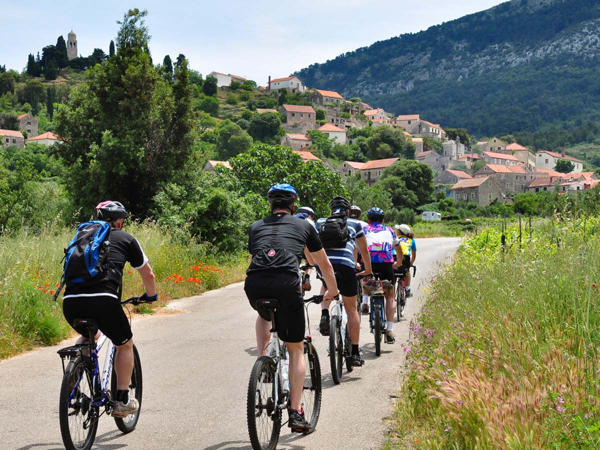 Group of bikers cycling in Hvar Island on a Family Adventure Tour in Croatia