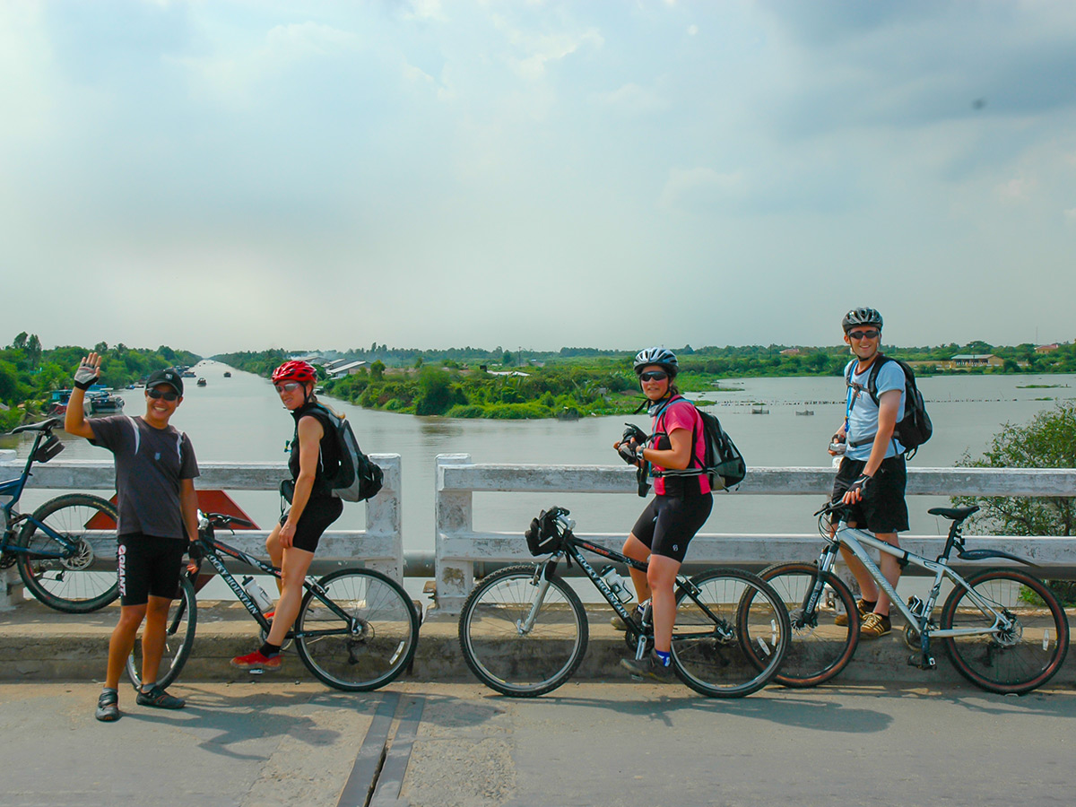 Group of bikers resting on the bridge on Coast of Vietnam Tour