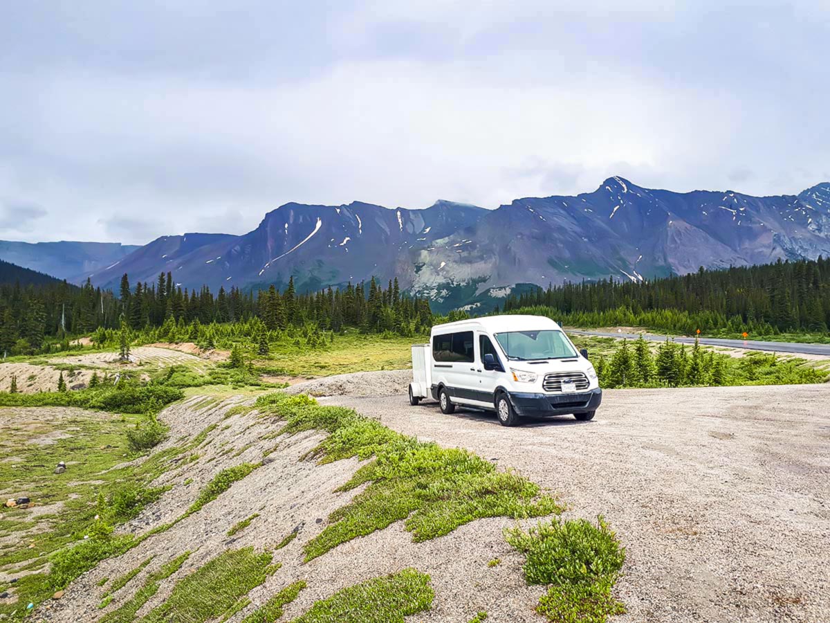 White van in the Canadian Rockies, accompanying the tour