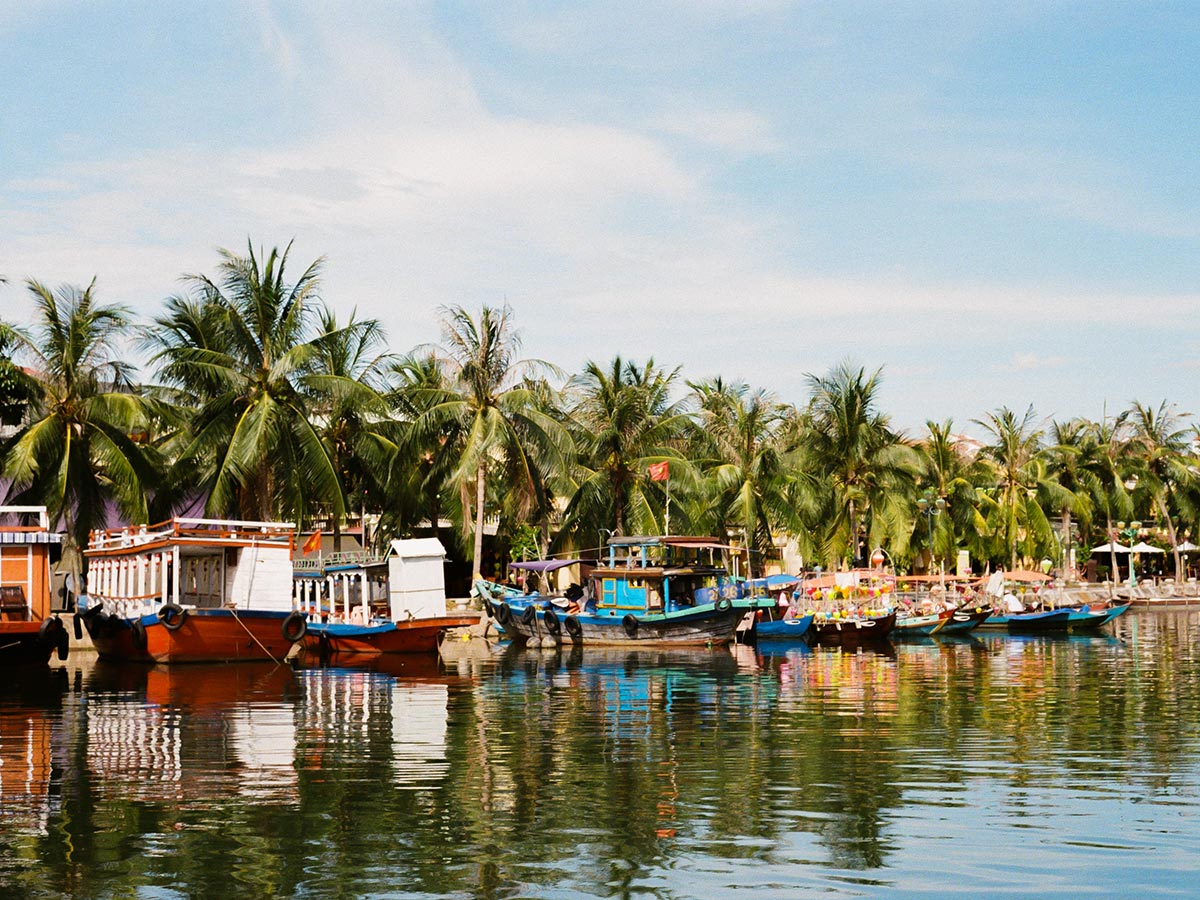 Boats in Hoi An seen on Coast of Vietnam Tour