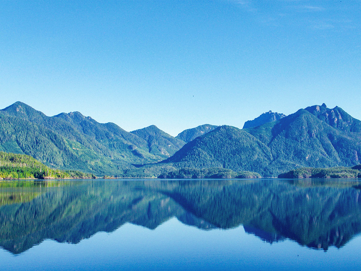 Mountains reflecting in the water in Barkley Sound Vancouver Island