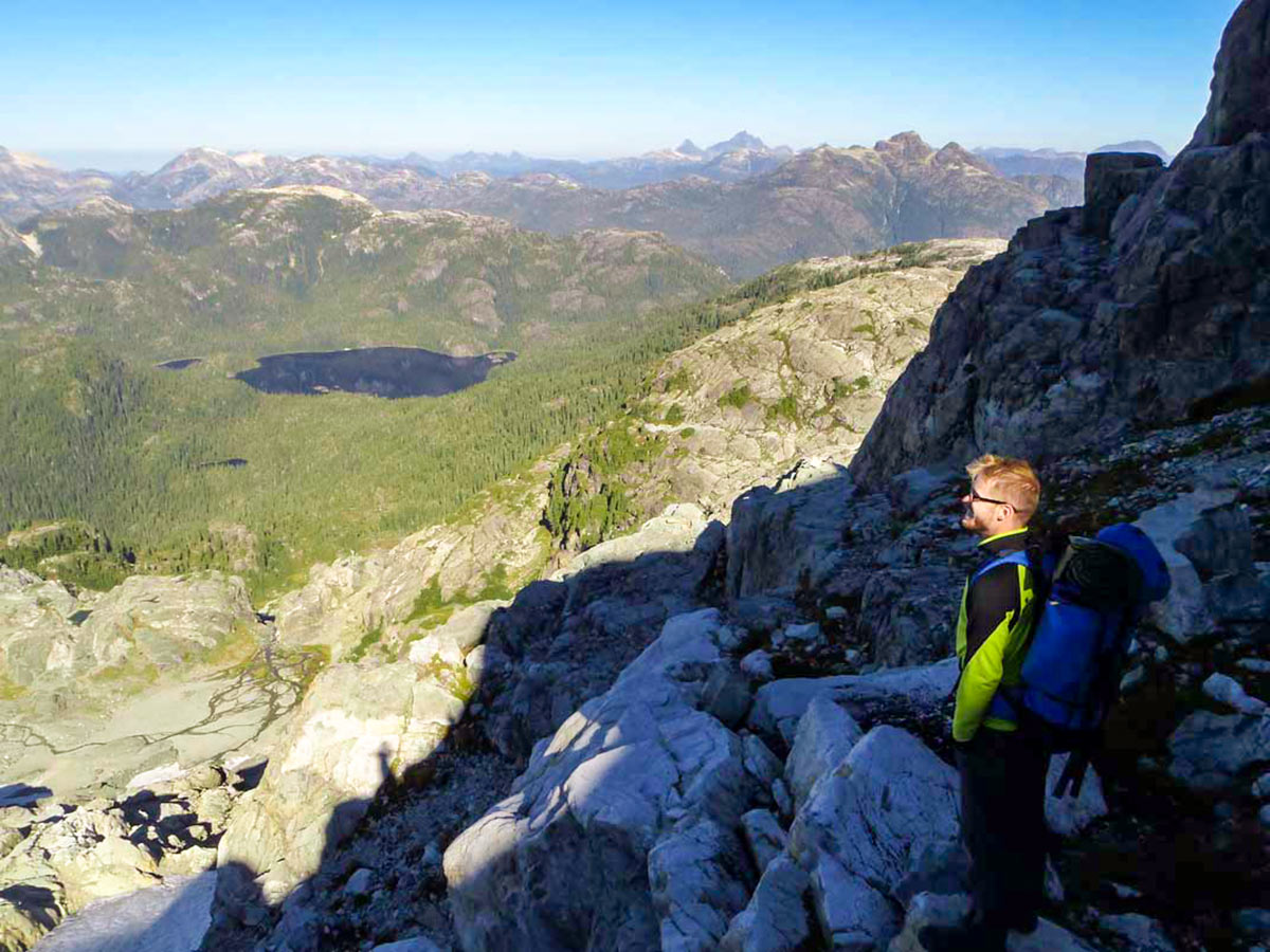 Hiker enjoying the views on Vancouver Island Hiking and Camping Tour with a guide