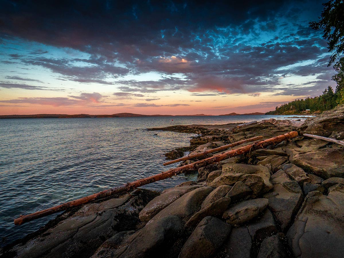 Sunset over the Vancouver Island seen on a guided camping tour