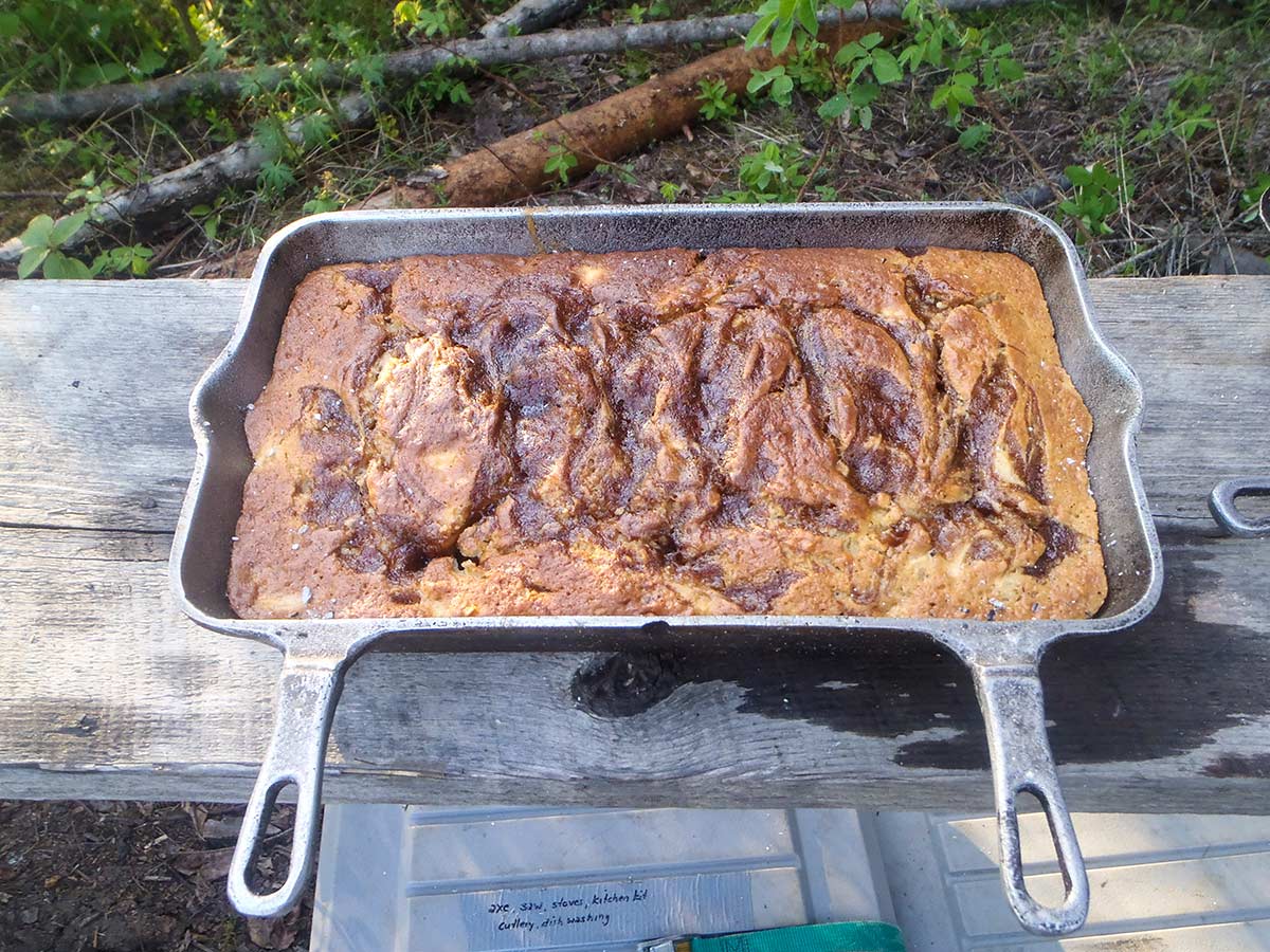 Cooking a meal while camping in Vancouver Island on a guided tour