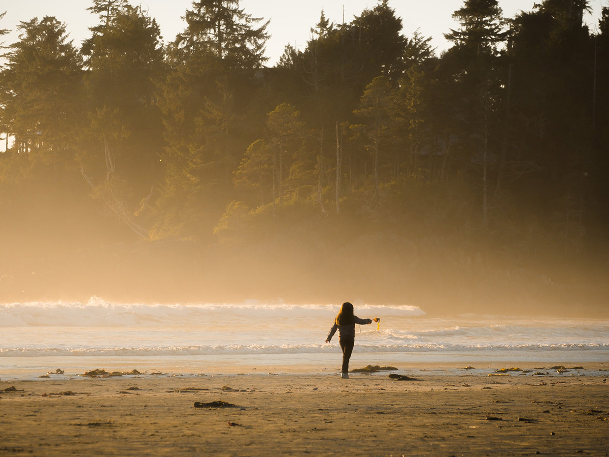 Lone hiker on a foggy beach on Vancouver Island Hiking and Camping Adventure