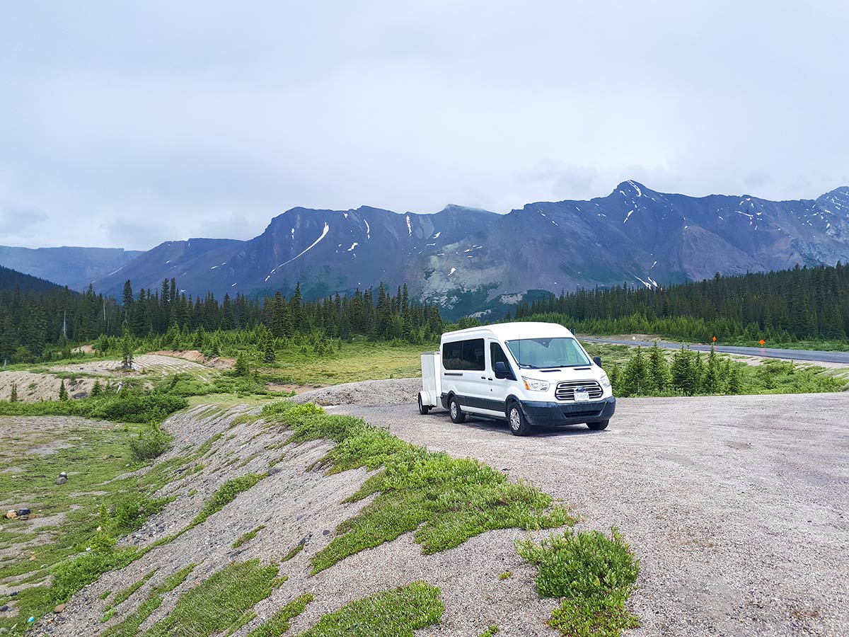 White wan surrounded by mountains in the Canadian Rockies