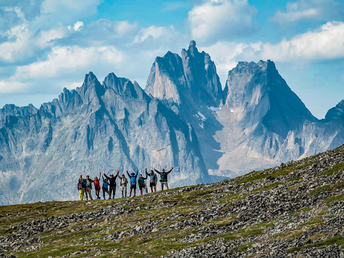 Group of hikers posing on a guided tour to Tombstone Territorial Park in Yukon, Canada