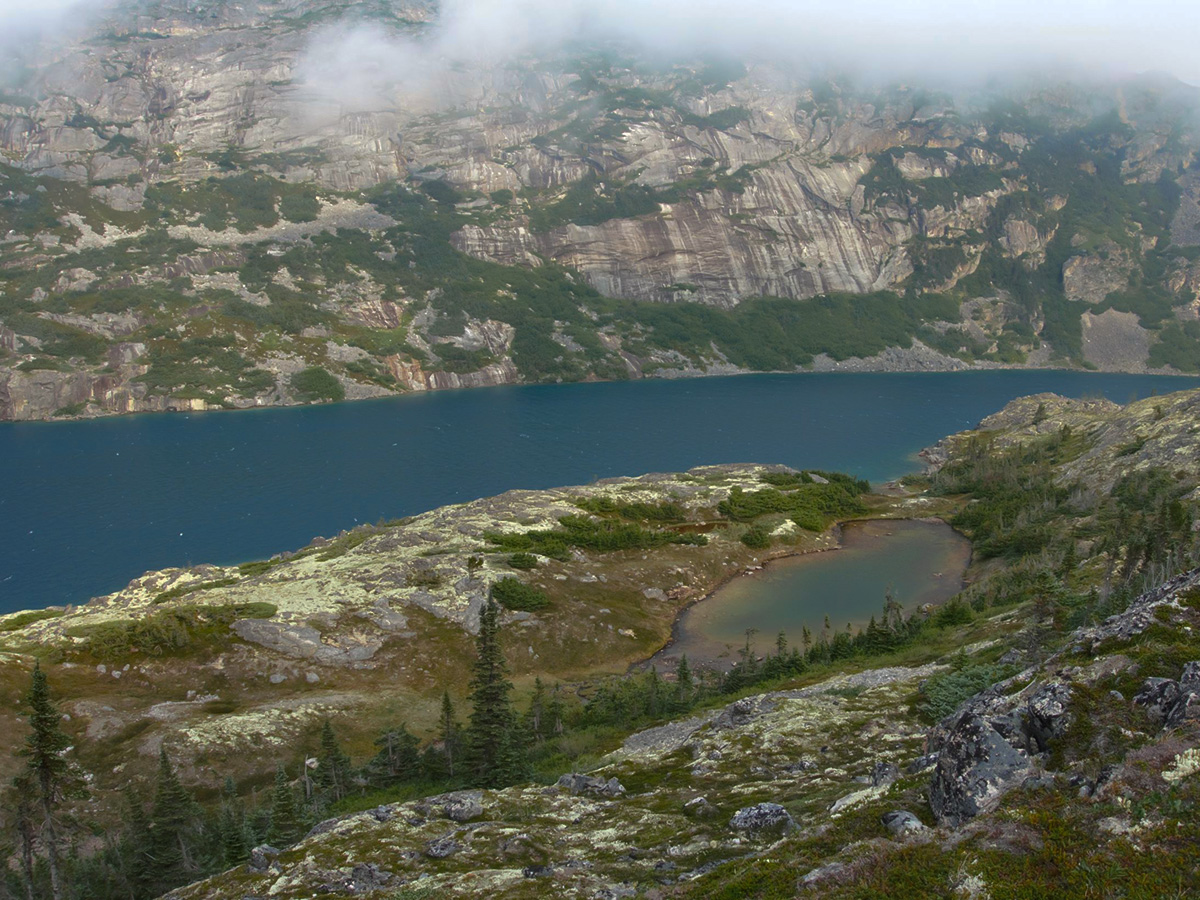 Overlooking the beautiful alpine lake on Chilkoot Trail tour with a guide