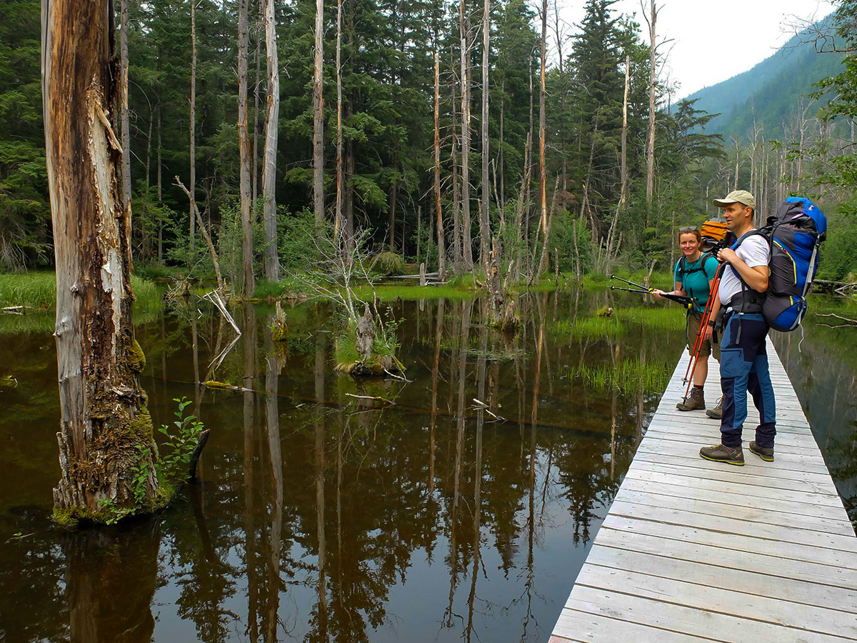 Crossing the Beaver Pond on Chilkoot Trail in USA and Canada