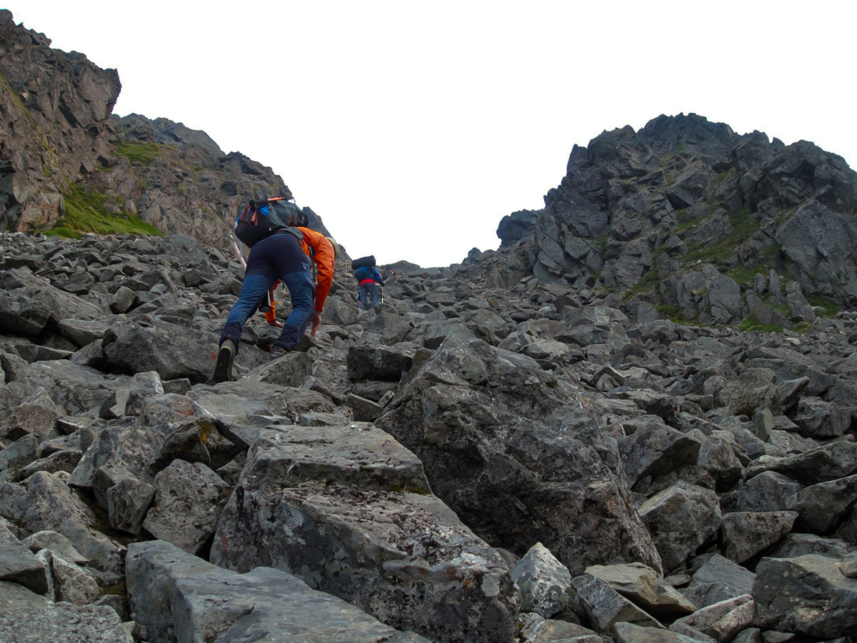 Scrambling to the pass on Chilkoot Trail with a guided tour