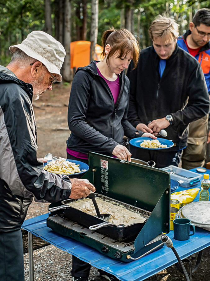 Group lunch in a camp on guided tour from Rockies to Alaska