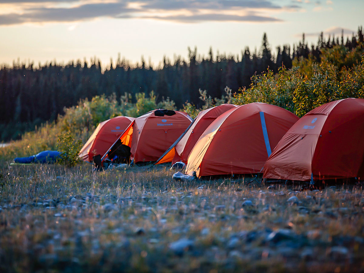 Midnight Sun over the campsite near Yukon River in Northern Canada