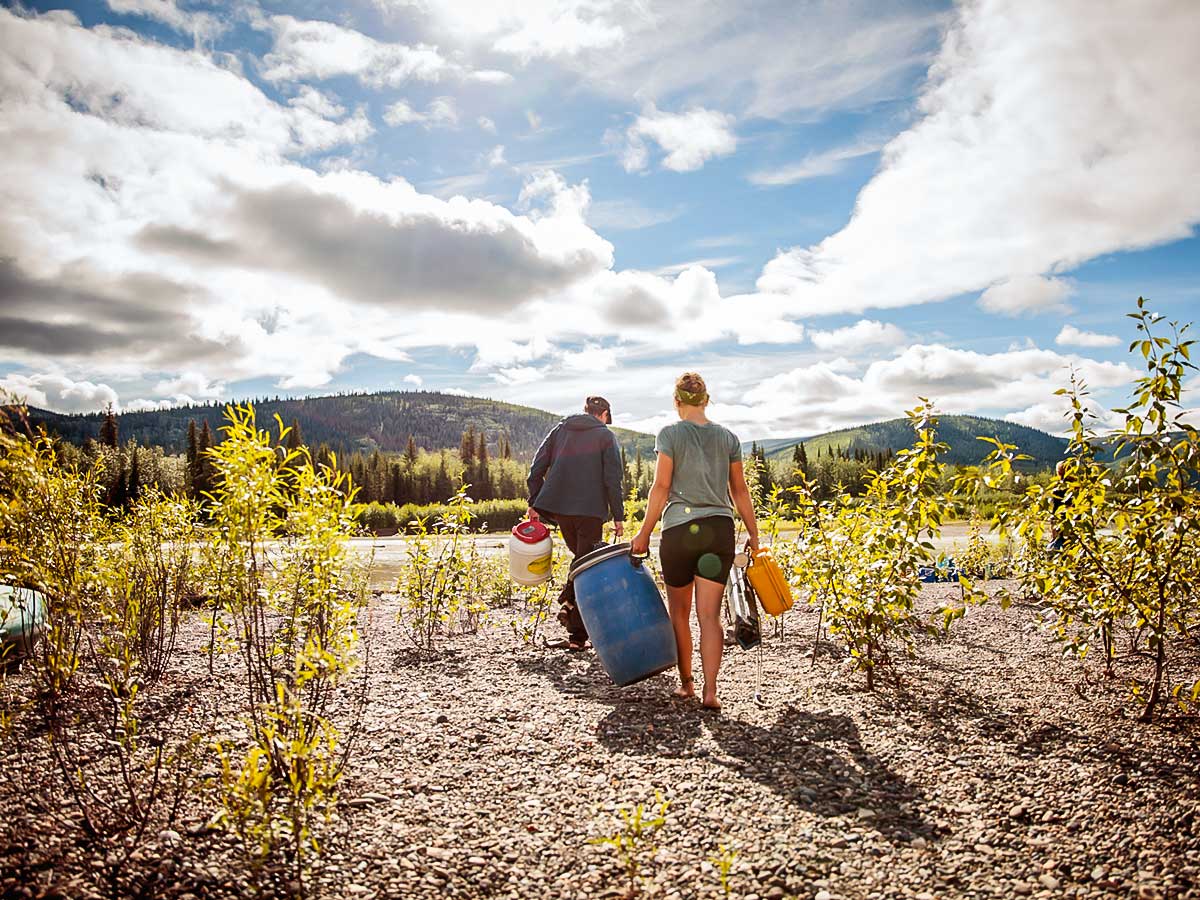 Carrying Gear on Yukon River Canoeing Tour with a guide